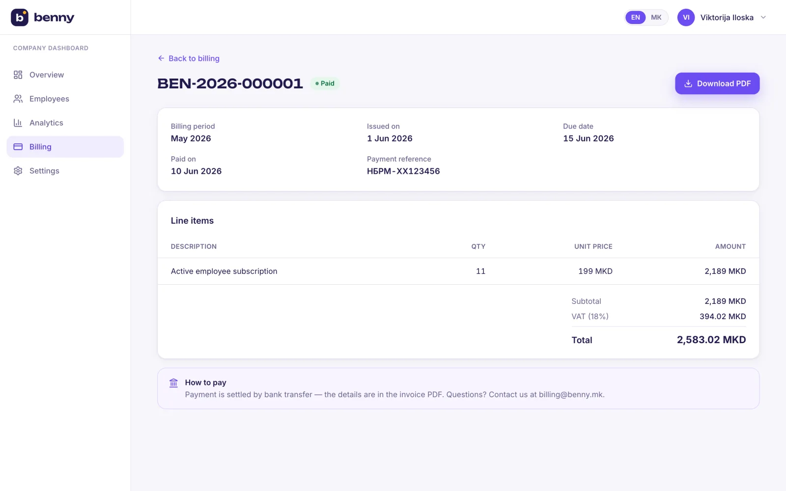 A single bilingual invoice with VAT and payment status